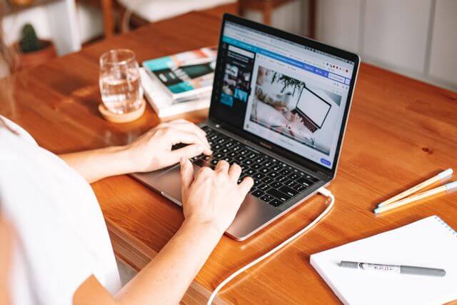 best AI writing generator laptop typing